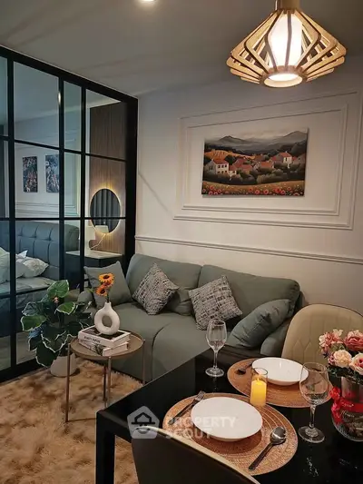 Stylish living room with cozy dining area and elegant decor in modern apartment.