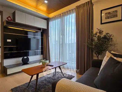 Modern living room with stylish decor and large window view