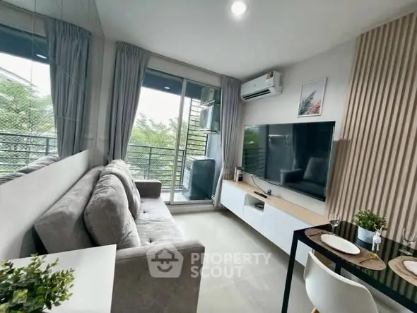 Modern living room with balcony access and stylish decor