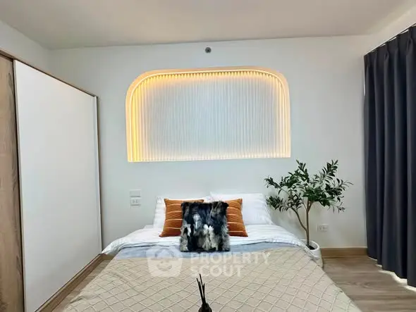 Modern bedroom with stylish lighting and cozy decor