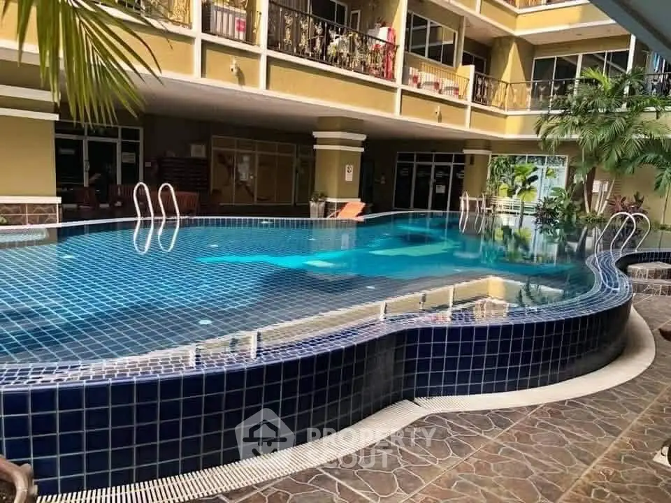 Luxurious apartment complex with stunning pool and modern design