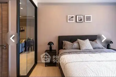 Modern bedroom with stylish decor and mirrored closet doors
