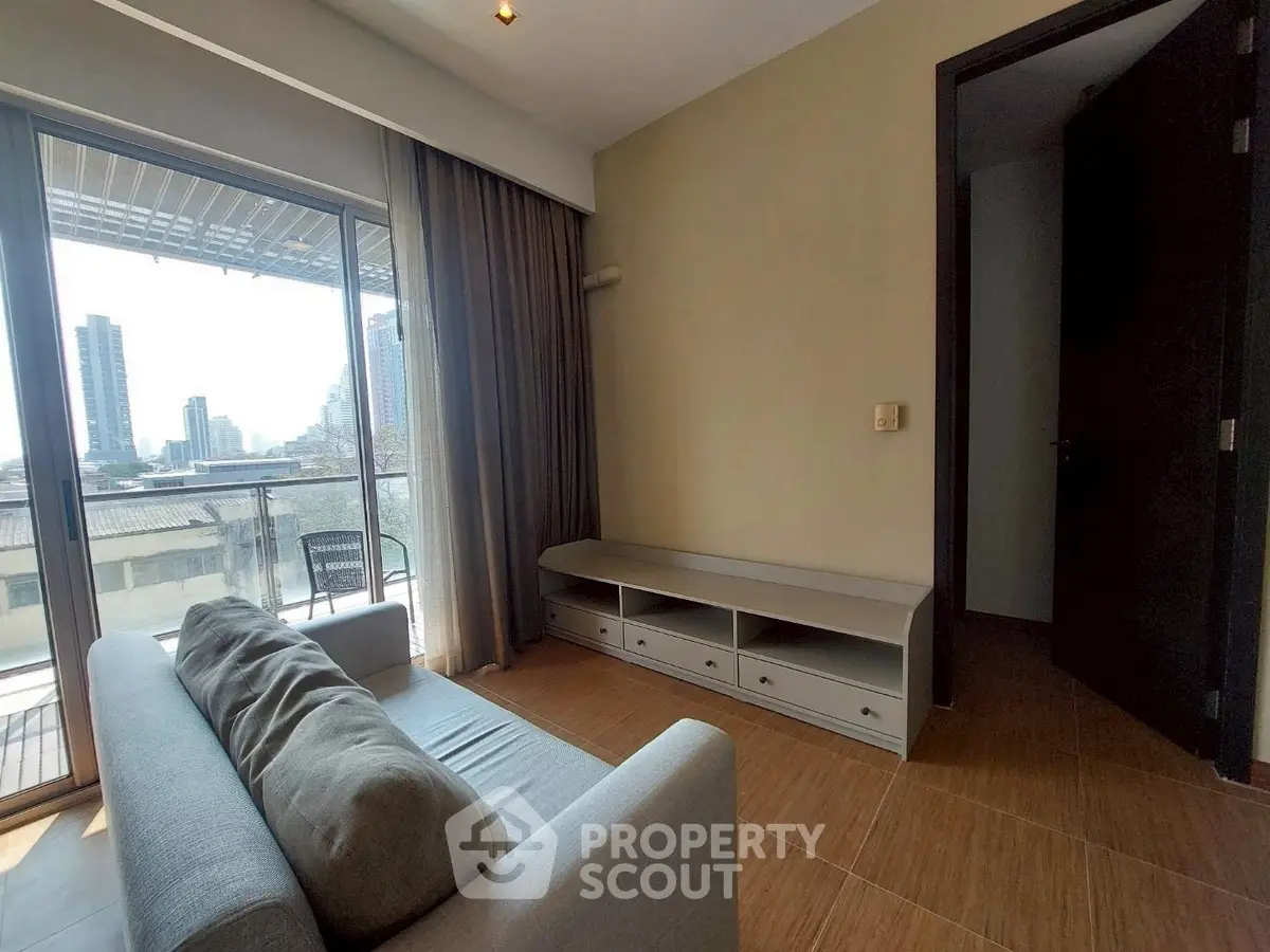 Modern living room with balcony view in urban apartment