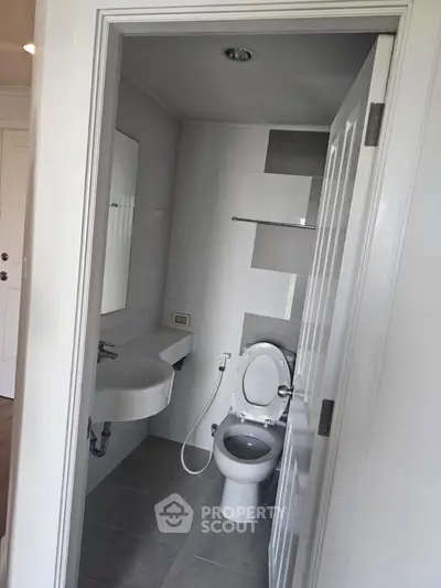 Compact bathroom with modern fixtures and sleek design