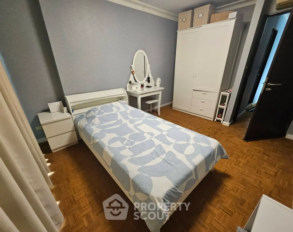 Cozy bedroom with stylish decor and ample storage space