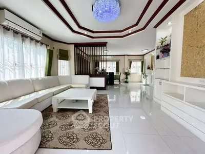 Spacious modern living room with elegant decor and ample natural light