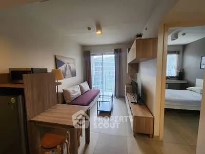 Modern open-plan living room with stylish furniture and natural light