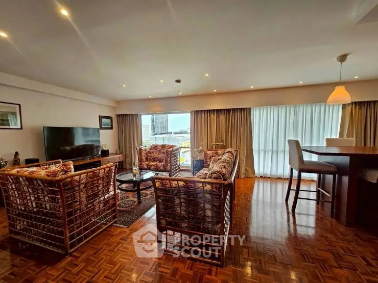 Spacious living room with elegant decor and city view
