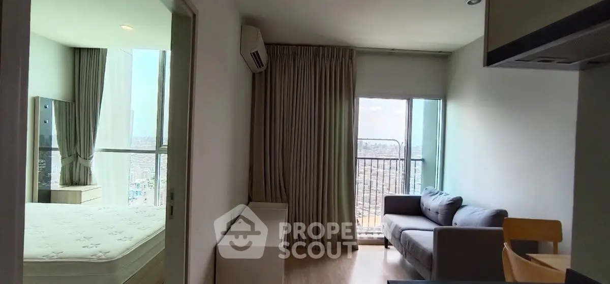 Modern apartment interior with city view, featuring cozy living area and bedroom.