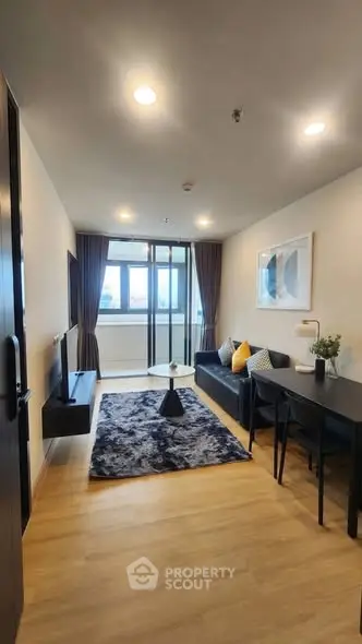 Modern living room with stylish decor and large window view