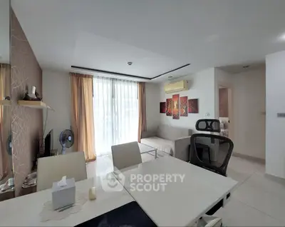 Spacious modern living room with elegant decor and ample natural light