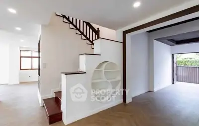 Modern interior with unique staircase and open layout, perfect for stylish living.