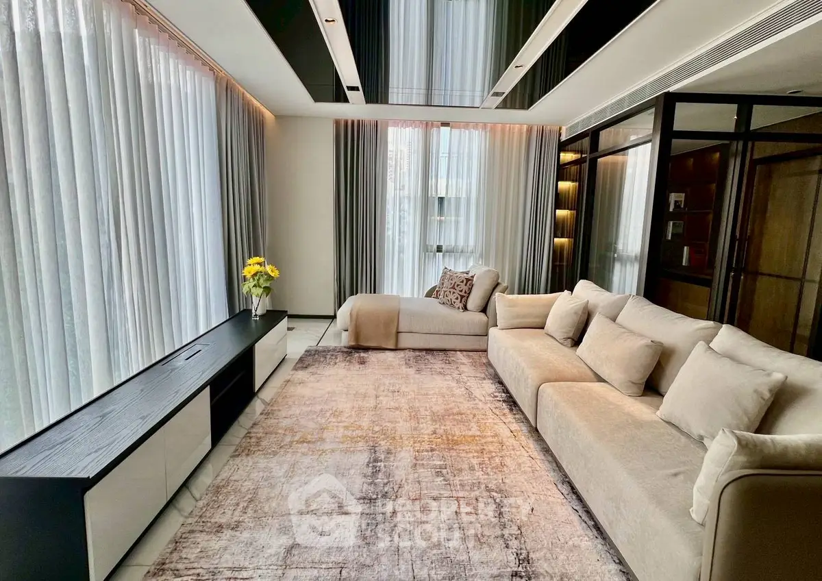 Luxurious modern living room with elegant sofa and large windows