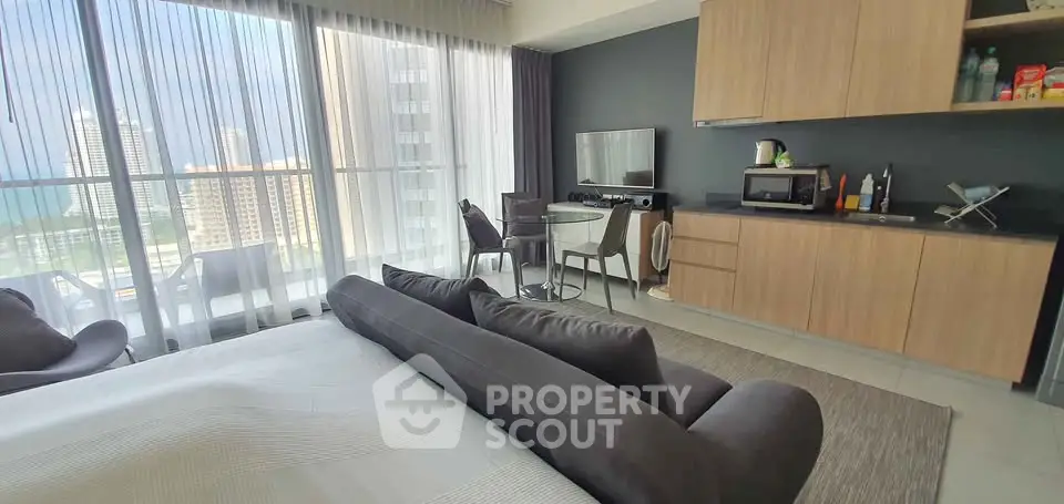 Modern studio apartment with open kitchen and stunning city view