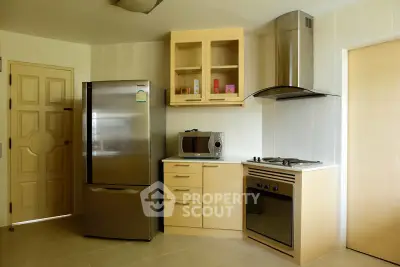 Modern kitchen with stainless steel appliances and sleek cabinetry