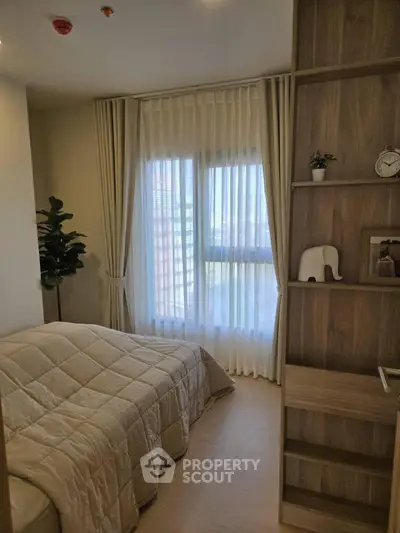 Cozy bedroom with elegant decor and natural light