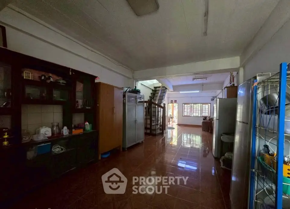 Spacious open-layout living area with natural light and modern furnishings, perfect for family gatherings.