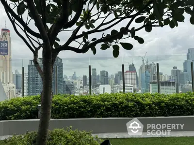 Stunning cityscape view from rooftop garden with lush greenery and skyline backdrop.