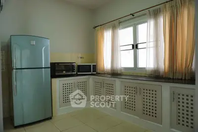 Spacious kitchen with modern appliances and ample natural light