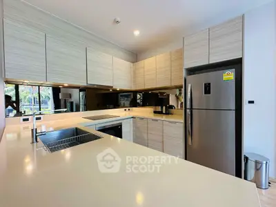 Modern kitchen with sleek cabinetry and stainless steel appliances