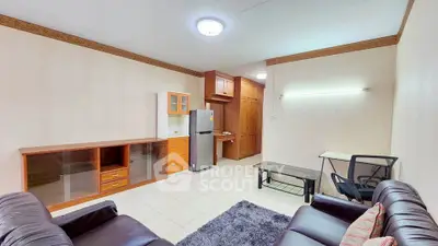 Spacious living room with modern furniture and open kitchen layout