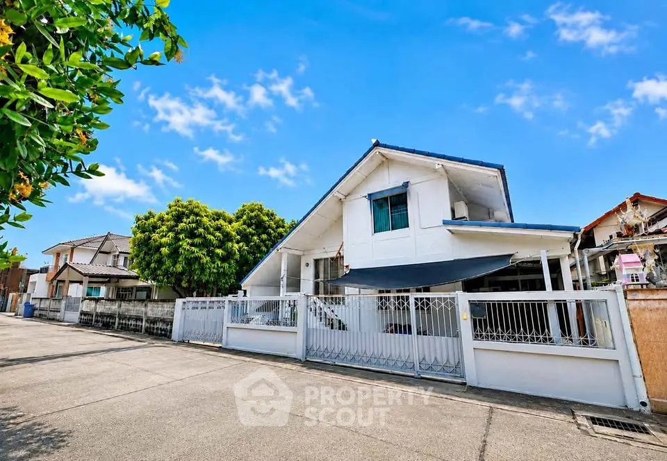 Charming suburban house with a spacious front yard and modern design, perfect for family living.