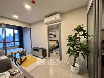 Modern apartment interior with open layout, featuring a cozy living area and stylish bedroom.