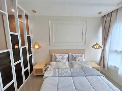 Modern bedroom with stylish decor and natural light