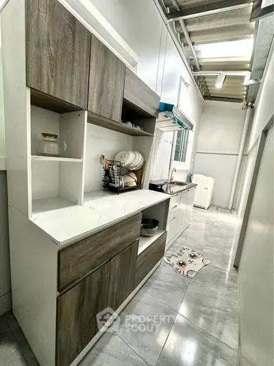 Modern kitchen with sleek cabinetry and ample storage space