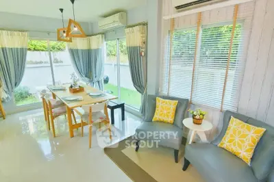 Bright and airy living room with dining area and garden view