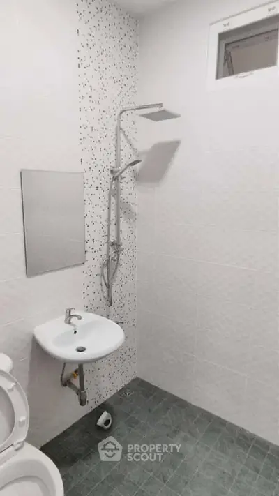 Modern bathroom with sleek shower and minimalist sink design