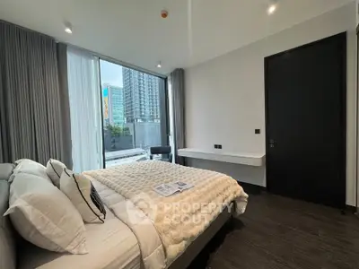 Luxurious bedroom with modern decor and city view, featuring plush bedding and sleek furnishings.