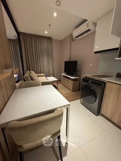 Modern living room with stylish furniture and integrated kitchen appliances