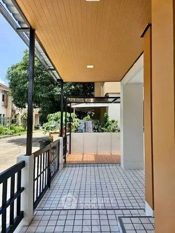 Charming house entrance with tiled patio and modern design