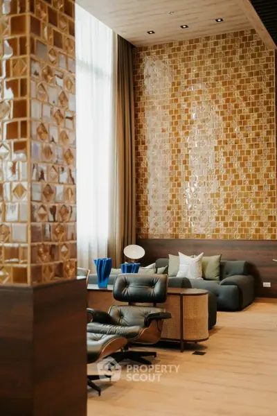Luxurious living room with modern design and elegant decor, featuring stylish furniture and large windows.