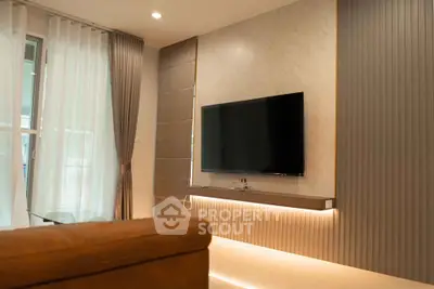 Modern living room with sleek TV setup and stylish lighting