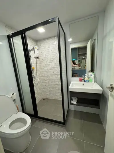 Modern bathroom with glass shower and sleek fixtures