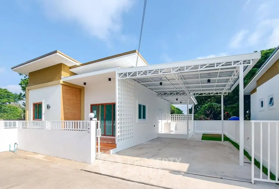 Modern single-story house with carport and minimalist design