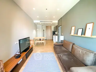 Modern living room with sleek furniture and open layout in a stylish apartment.