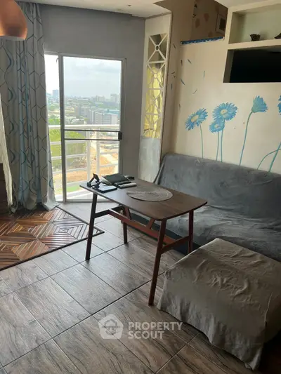 Charming living room with city view, cozy decor, and natural light, perfect for relaxation and entertaining.