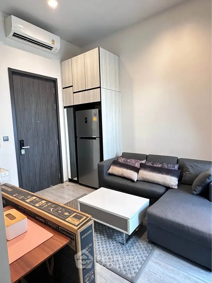 Modern living room with sleek furniture and built-in storage, perfect for urban living.
