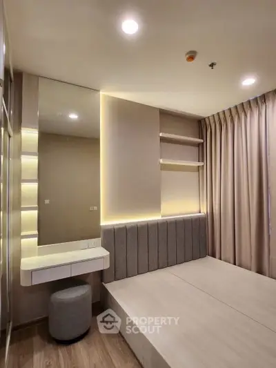 Modern bedroom with sleek design, built-in shelves, and ambient lighting for a cozy atmosphere.
