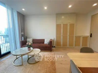 Modern living room with stylish furniture and city view, perfect for urban living.