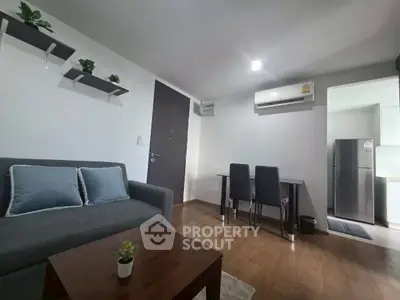 Modern living room with sleek furniture and air conditioning, perfect for urban living.
