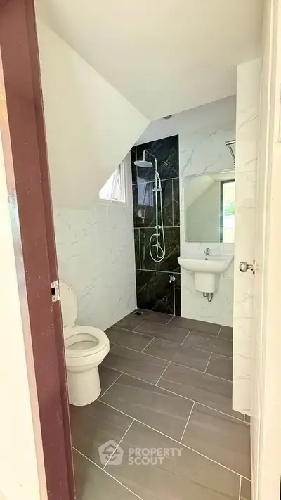 Modern bathroom with sleek design and elegant fixtures in a contemporary home.