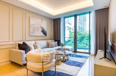 Luxurious modern living room with elegant decor and stunning balcony view.