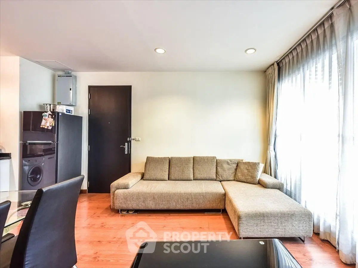 Modern living room with stylish sofa and natural light