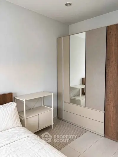 Modern bedroom with sleek wardrobe and minimalist design