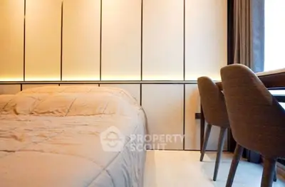 Modern bedroom with stylish lighting and cozy bedding