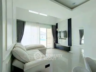 Spacious modern living room with elegant decor and natural light